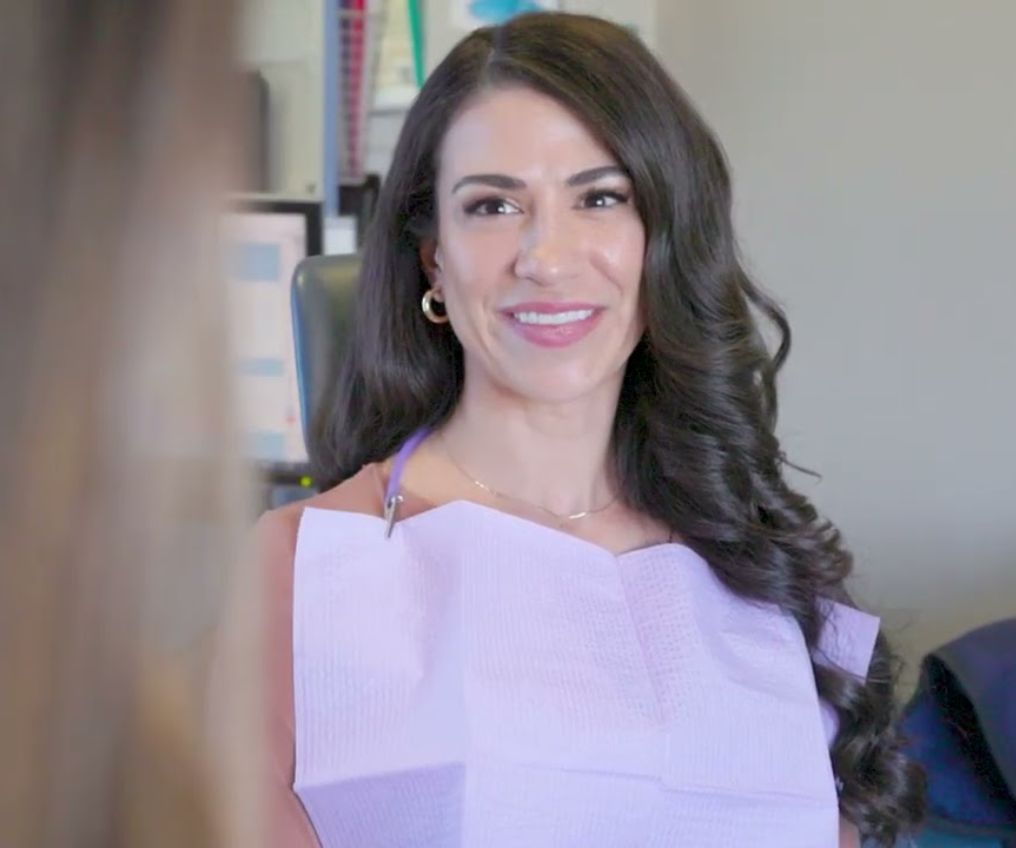 Smiling female cosmetic dentistry patient at Etesse Holistic and Cosmetic Dentistry
